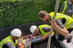 men working with yellow vests