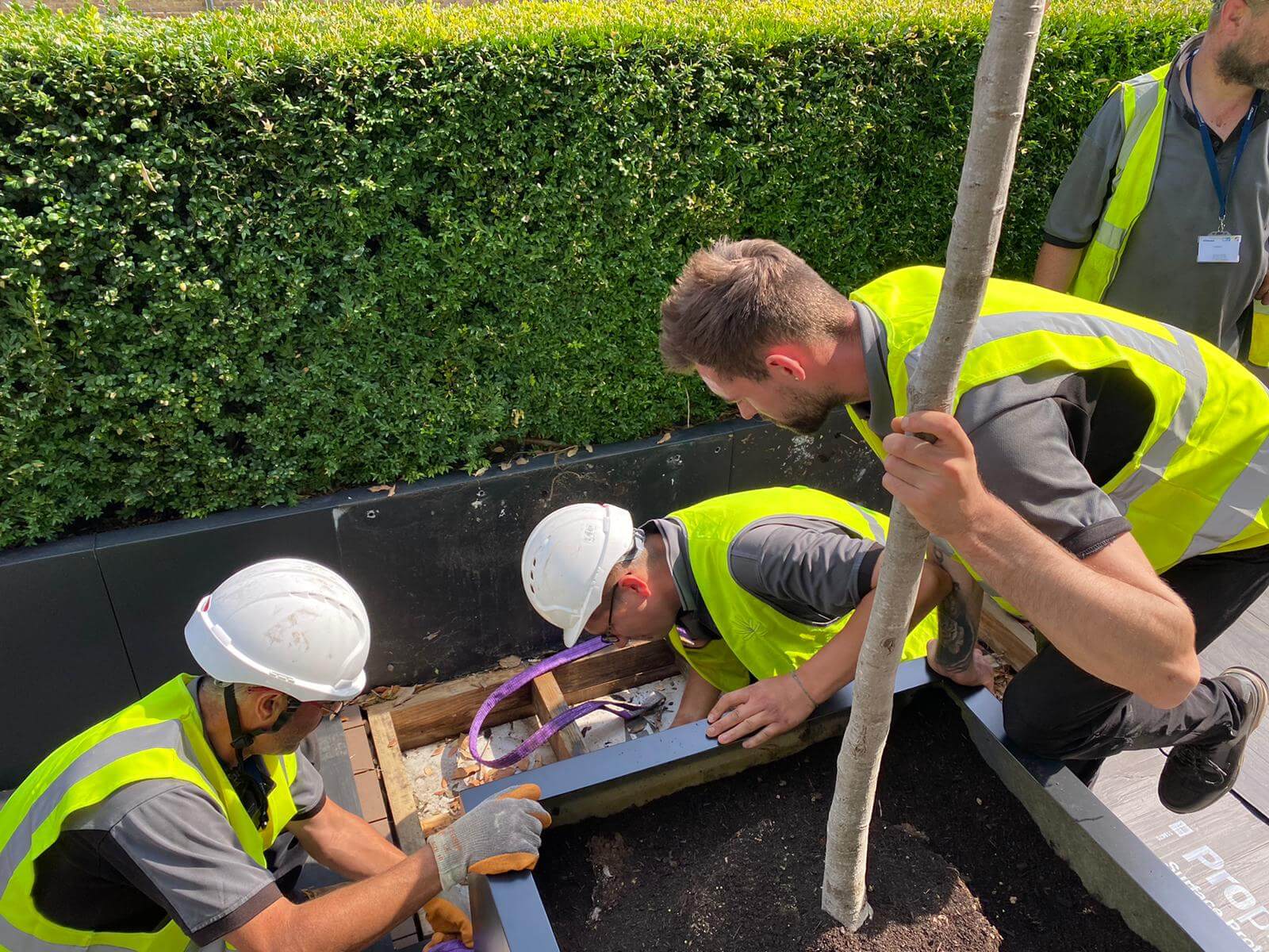 men working with yellow vests