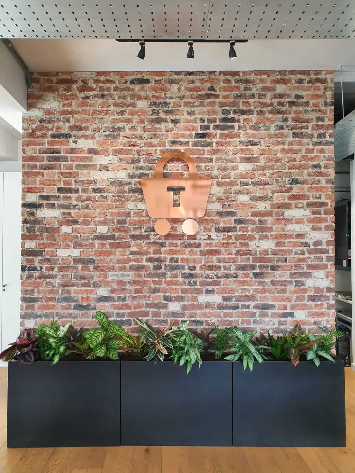 Basket Icon Above Black Planters