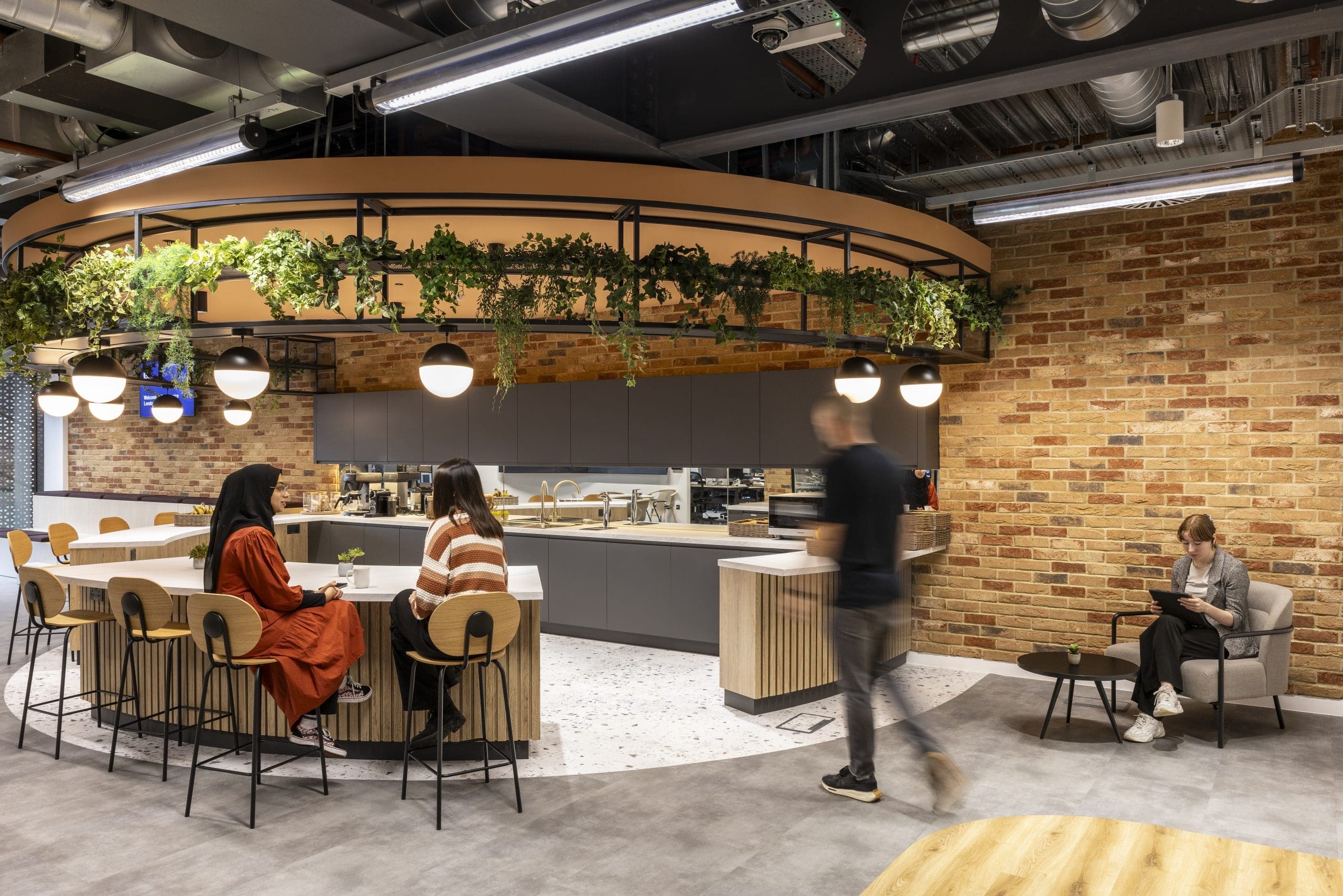 Replica hanging plants by Verdantia in the stunning Bazaar Voice London office
