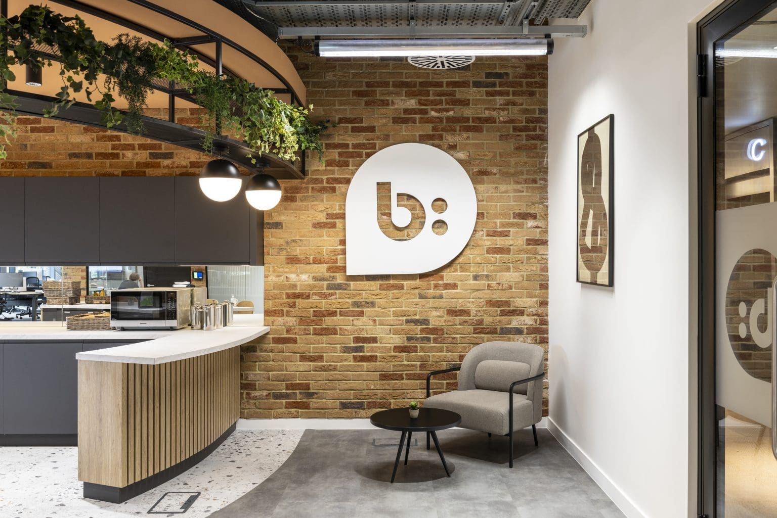 Replica hanging plants by Verdantia in the stunning Bazaar Voice London office
